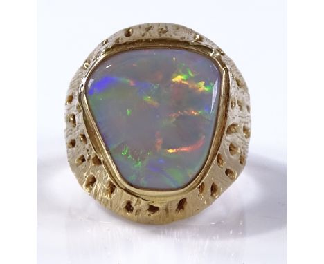 A large 18ct gold naturalistic opal set ring, setting height 25.5mm, size W, 26.1g