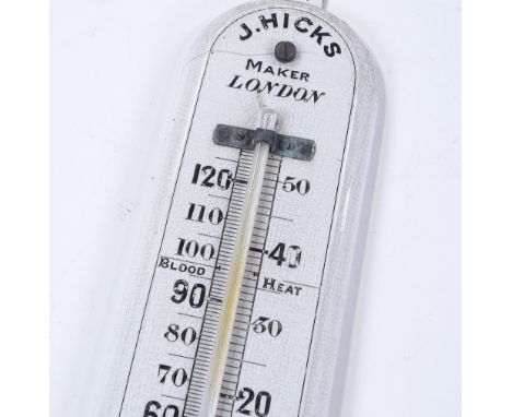 A large ceramic wall thermometer by J Hicks of London, height 52cm