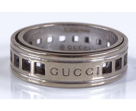 An 18ct gold Gucci spinning ring, with square openwork lattice band, band width 5.5mm, size K, 4.9g