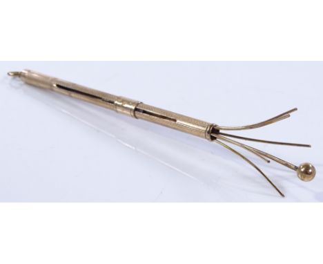 An Asprey's 9ct gold swizzle stick