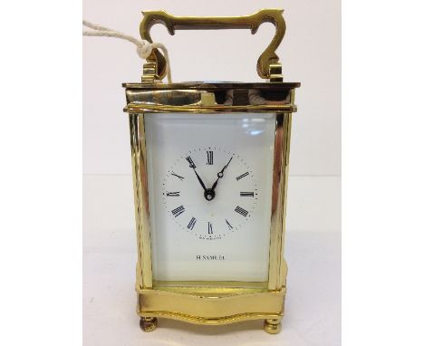 A brass and glass cased H Samuel carriage clock.