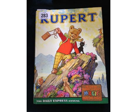 A 1964 Rupert Annual with Magic Painting section (first picture and one other coloured in), (a fair copy).
