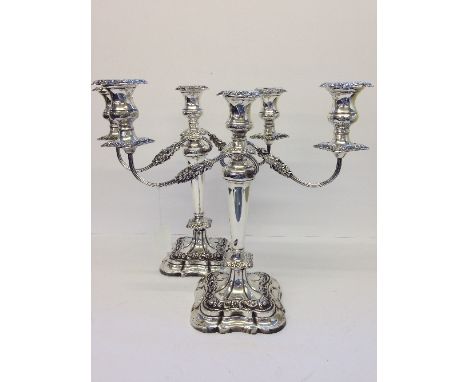 A pair of silver three light, two branch candelabra by Viners, Sheffield, circa 1960's, the vase shape capitals with gadroone