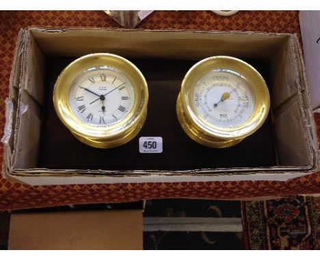 A reproduction quartz ship's clock together with a barometer on wooden mount.