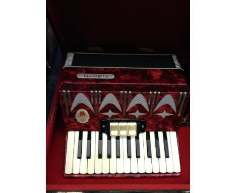 An early 20th century Firotti Italian piano accordion. 