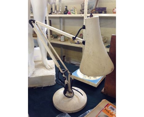 A white painted angle poise lamp.