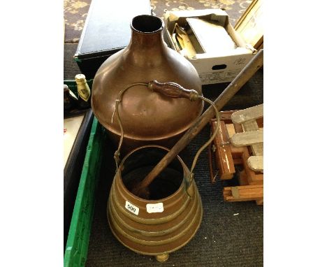 A copper flask together with a copper bucket and wooden ladle.