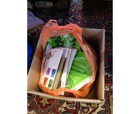A box of stamps and First Day Covers.