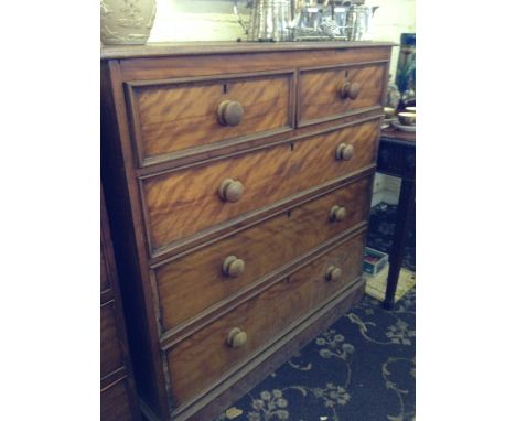 A light mahogany chest of two short and three long drawers.