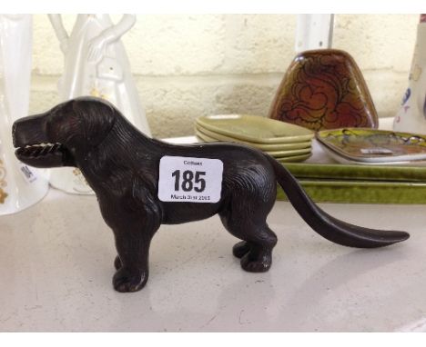 A novelty cast iron nut cracker modelled as a Dog.