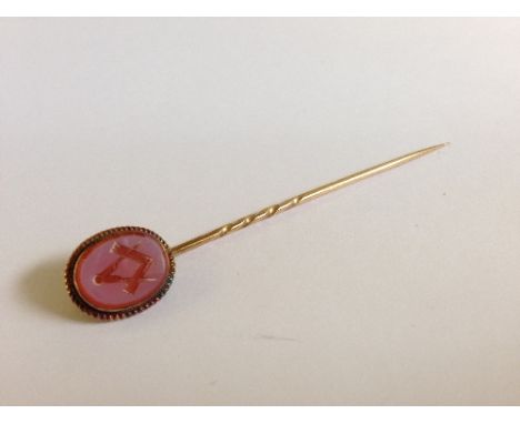 A 19th century gold Masonic stick pin with Square and Compass decoration.