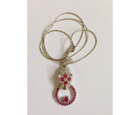 A silver and ruby set Panther necklace.