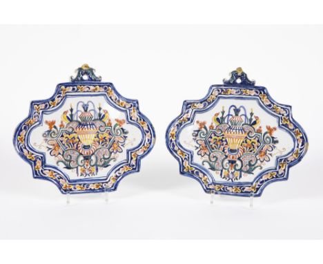 pair of presumably 18th Cent plaques in ceramic from Delft, marked IVRN 1744, with a baroque style design and polychromed dec