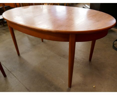 A Jentique 515 model teak extending table 