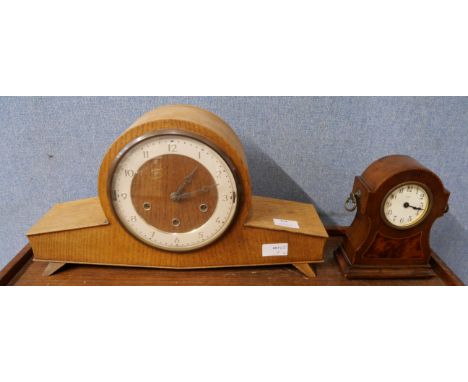 Two clocks; one eight day mantel clock with wooden inlay and bevelled glass face, and one vintage 1970s mantel clock 