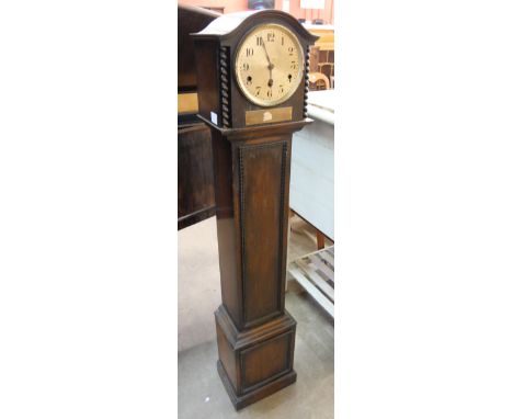 An early 20th Century oak dwarf longcase clock 