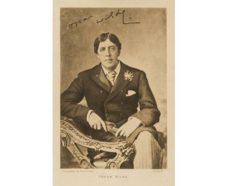 Wilde (Oscar) Cut signature, c.65 x 180mm., dated 'Nov. 9 93', together with a photographic portrait of Wilde, mounted, frame