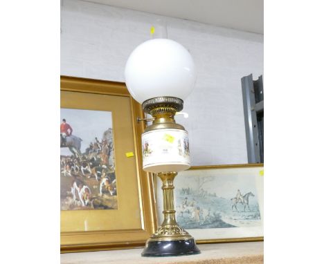 Brass column oil lamp with ceramic reservoir depicting hunting scenes and glass shade, 60 cm high    