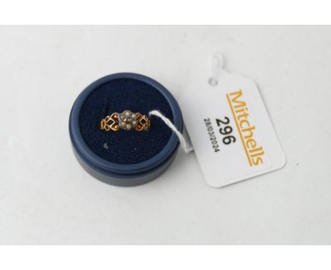 Yellow metal ring with seed pearl decoration, weight 1.5 grams