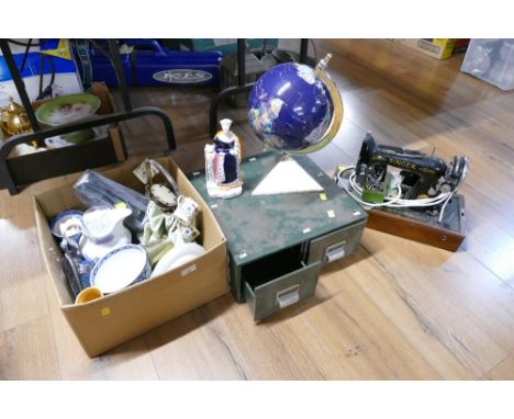 Singer sewing machine, green metal filing drawers and box of glassware and ceramics including ornamental desktop globe 