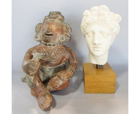 A small plaster cast classical bust set of a wooden plinth with a lead seal to the base, 24cm high, together with a terracott