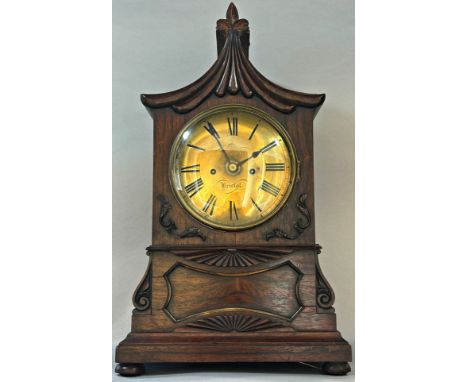 A Regency rosewood bracket clock with pagoda top, the casework with applied detail, enclosing a convex brass dial, two train 