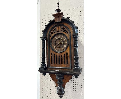 A black forest oak and ebonised cuckoo wall clock presented as a bracket clock, with eight twin fusee movement striking on a 