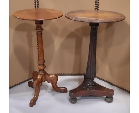 A Victorian mixed wood occasional table with circular top raised on a reeded vase shaped pillar, tricorn platform and turned 