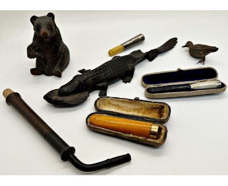 Collection of miscellaneous effects including a Tyrolean carved hardwood bear in a seated pose, silver plated cigarette case 