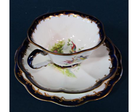 A George Jones tea service with exotic bird detail for twelve (with omissions) including muffin dish and cover, two sandwich 
