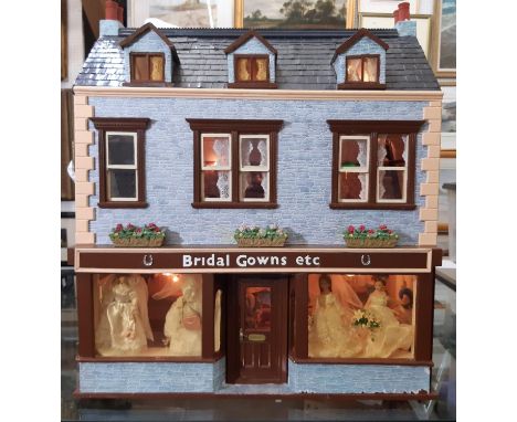 'Bridal Gowns etc'- an impressive and finely detailed period style dolls house shop comprising 3 storeys, front and roof open