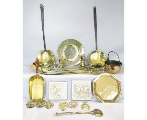 A collection of highly polished antique brassware including a set of weights, coal shovel, saucepans, fire tools, chestnut ro