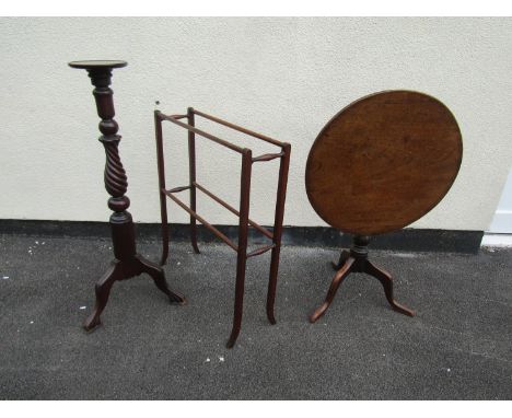 A Georgian mahogany snap top table on turned pillar and tripod, a Victorian towel rail with turned supports and a torchere wi