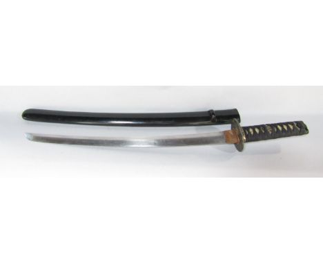 A Japanese Wakizashi short sword in a black lacquered scabbard and ray skin grip bound with black silk braid, blade length 46