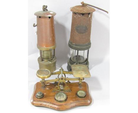 A set of 19th century brass postal scale on an oak stand, with some odd weights, together with a rusty E Thomas &amp; William