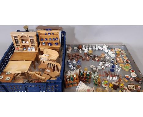 A large collection of dolls house furnishings comprising kitchen related furniture, foods and utensils; includes cooking rang