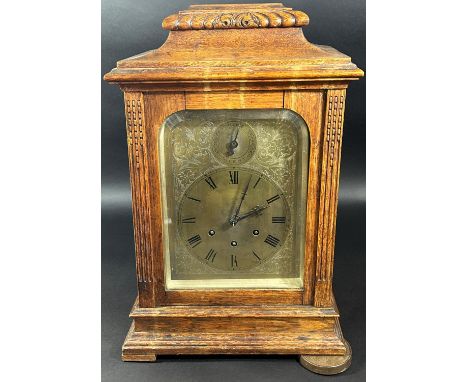 A late 19th century bracket clock with engraved brass dial, silent/chime selector and three train movement 