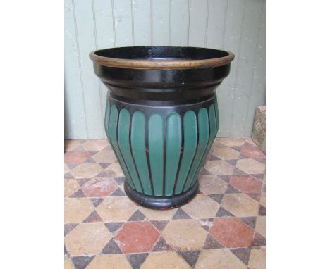 A heavy painted cast iron oviform planter with repeating fluted body, 52cm diameter at rim, x 60cm high 