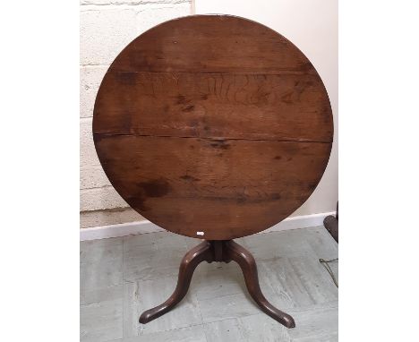 A Georgian oak snaptop table raised on a turned tripod and pillar, 80cm diameter (Warehouse 1) 