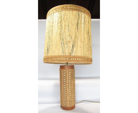A retro table lamp c.1960s teak and fibre glass with a crochet string covering and matching shade, 79cm high total 