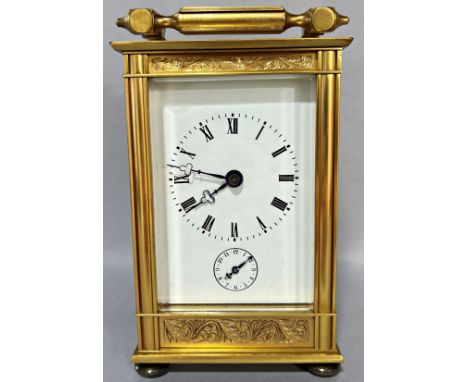 A good quality contemporary French carriage clock, the eleven jewel movement with strike action and alarm, the case with chas