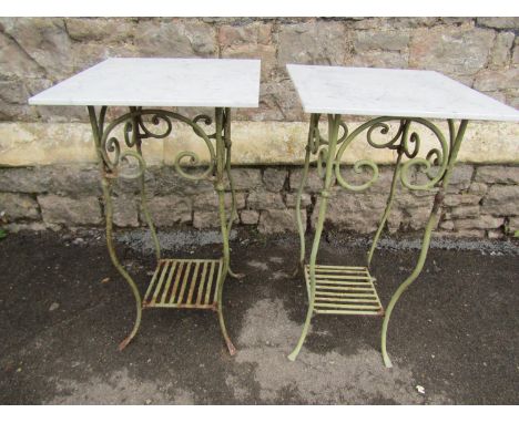 A pair of light green painted iron work conservatory or garden table with simple scrollwork detail beneath square overhanging