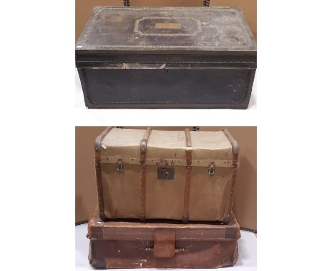 A Georgian leather overlaid and studded camphor wood trunk with hinged lid and drop side carrying handles, brass plaque to li