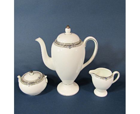 A collection of Wedgwood Amherst porcelain coffee cans and saucers with coffee pot, sugar basin and cream jug, together with 