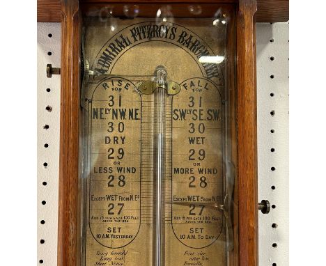 Admiral Fitzroy barometer with an oxford style oak framework with printed back panel and fittings 