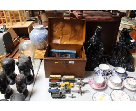 A small metal travelling trunk and contents of various diecast vehicles to include Dinky examples