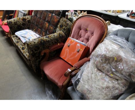 A Victorian pink upholstered button back armchair