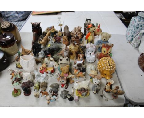 A quantity of various ornaments to include Poole Pottery dolphin etc.