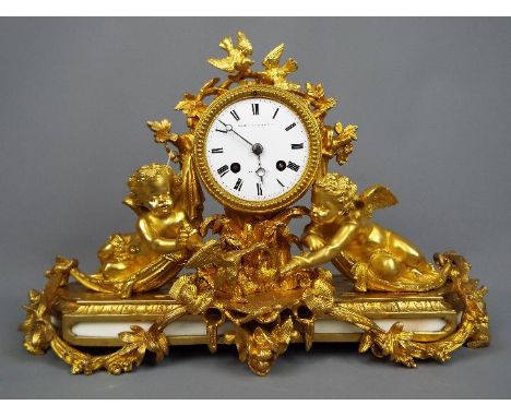 A good, classical-styled ormolu French mantel clock, the case having the figures of cherubs either side of the movement drum,