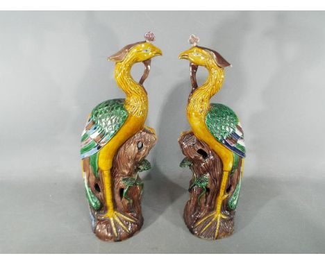 A pair of 19th Chinese sancai glaze figurines depicting Fenghuang (phoenix), approximately 32 cm (h). [2] Condition Report - 